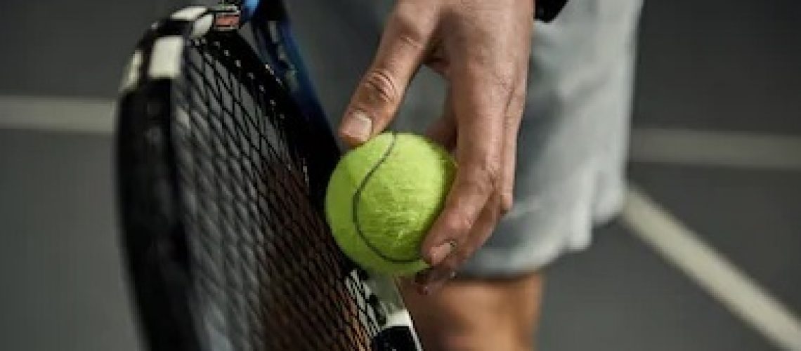 man holding racquet